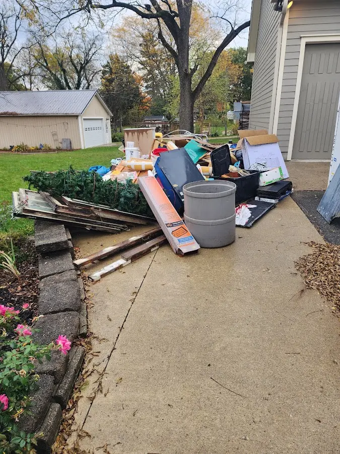 Dumpster being loaded with debris for 3 Yard Dumpster Rental in Galion